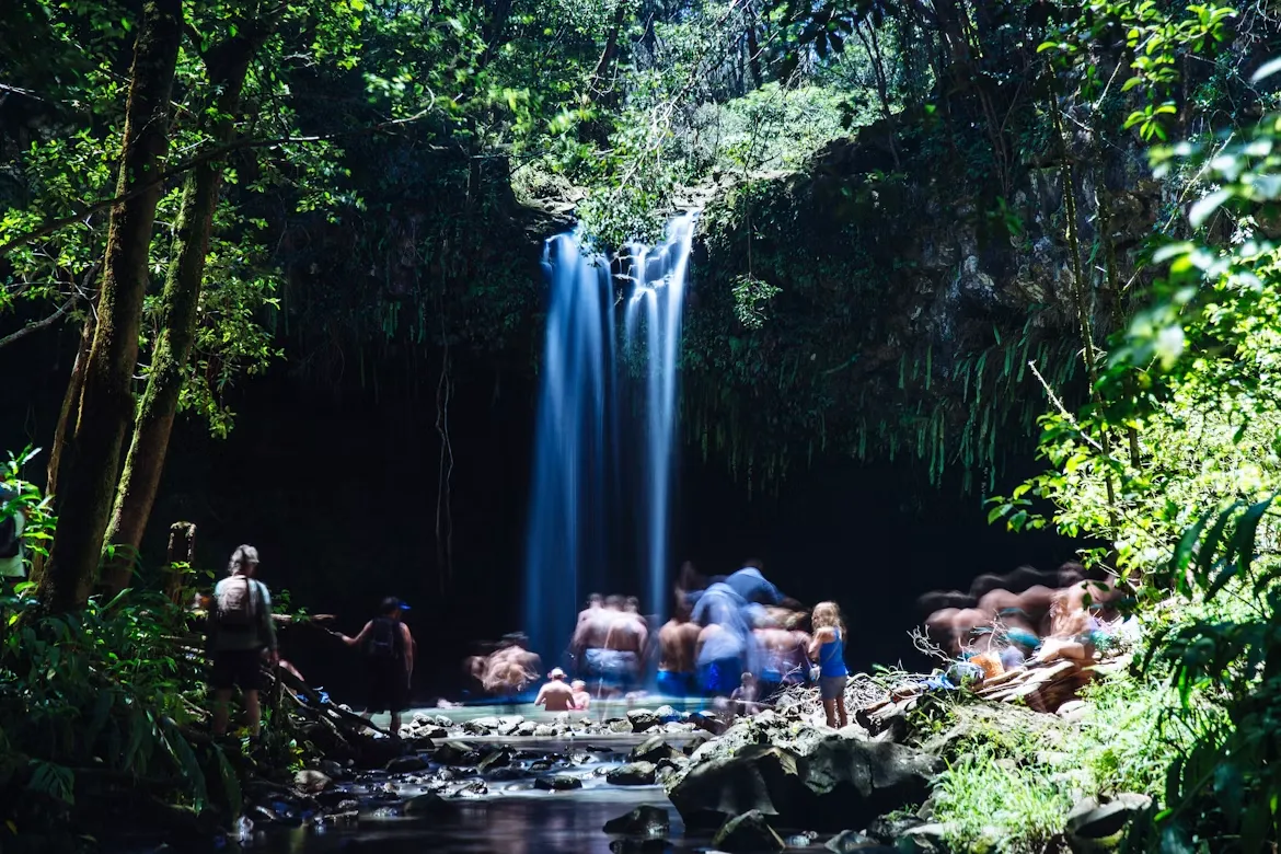 "People near waterfalls during daytime" by Rina Miele, via Unsplash