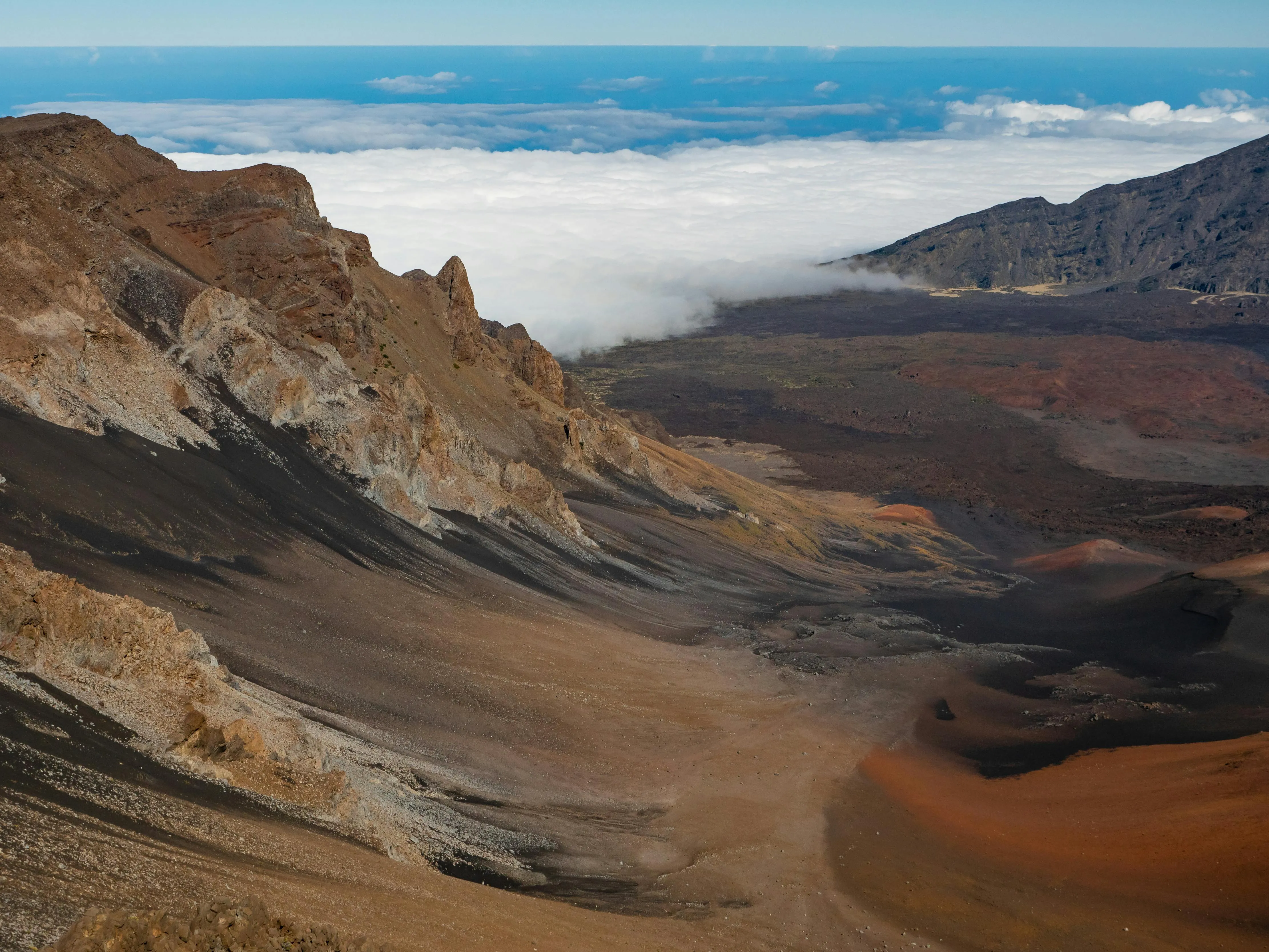 Breathtaking view of Haleakala Crater with clouds in the distance on Maui, Hawaii. - Photo by James Wheeler, via Pexels, modified